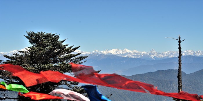 Image showing the snow covered himalayas in Bhutan and prayer flags
